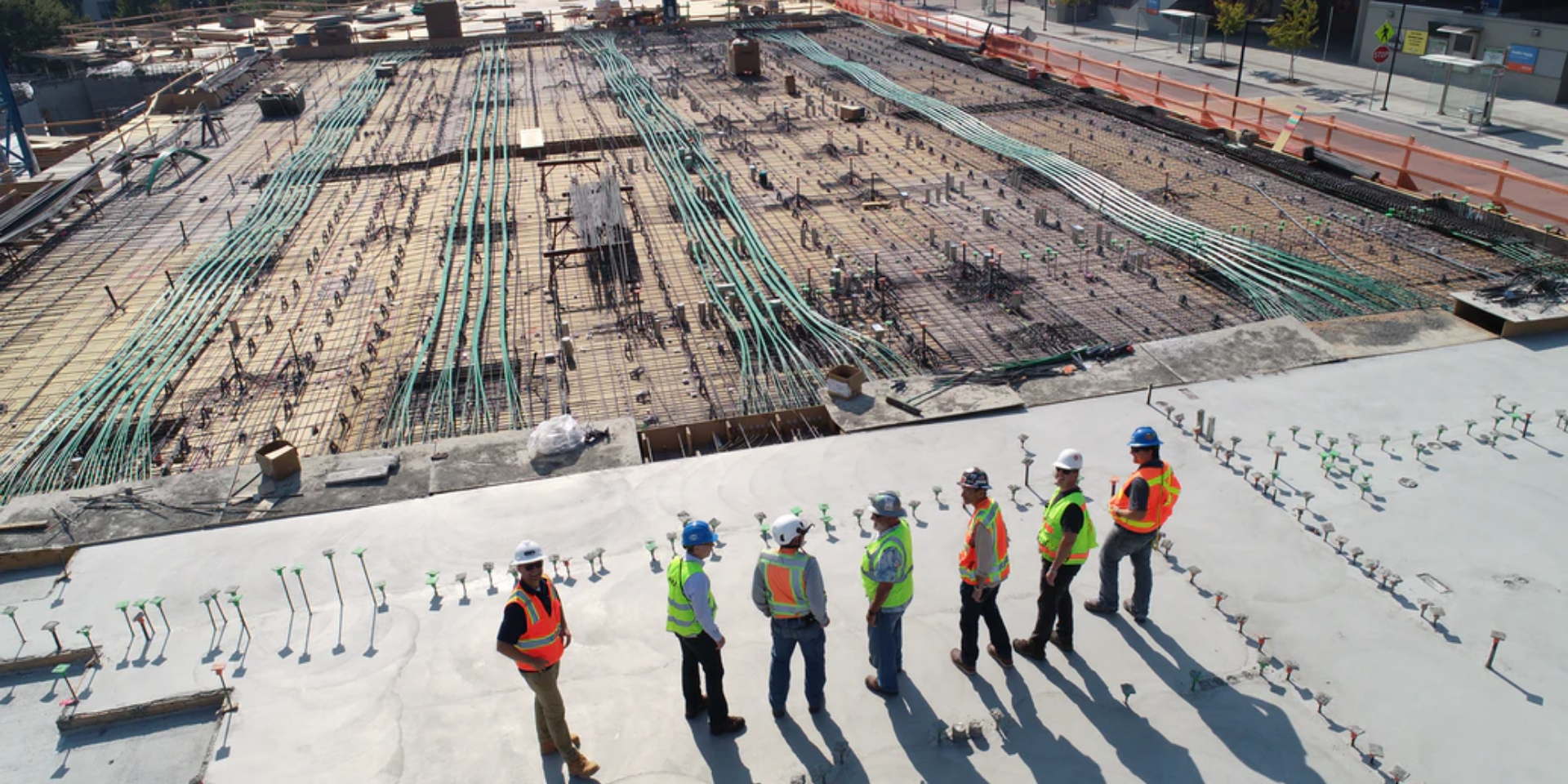 Construction site with workers overseeing industrial infrastructure